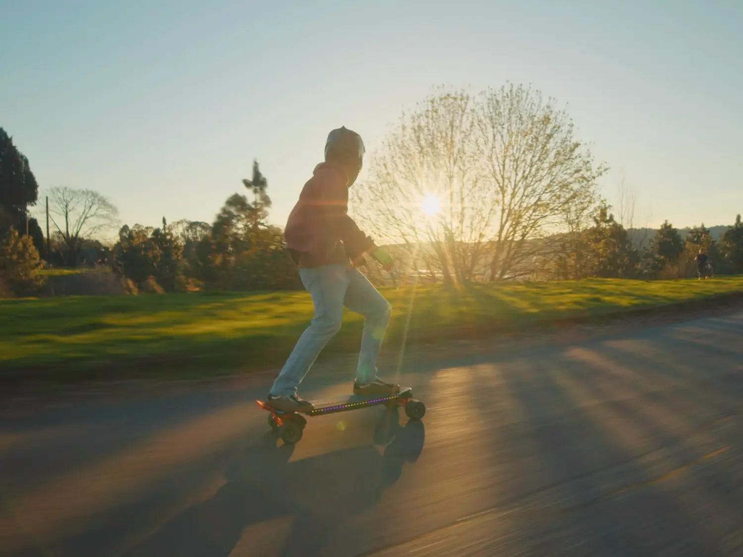 Electric skateboard rider on a European city street
