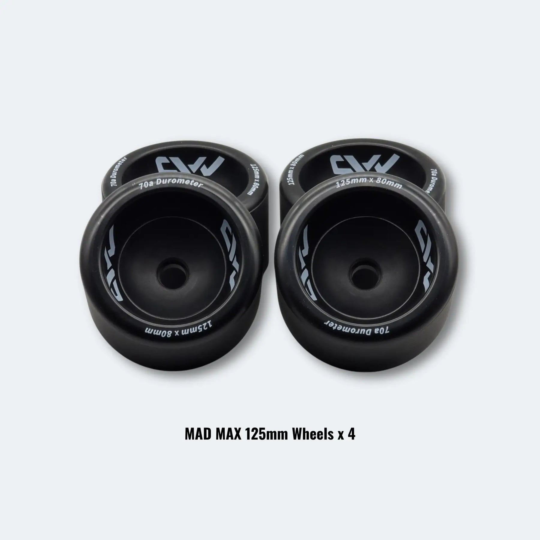 A set of four black MAD MAX 125mm wheels arranged in two rows on a white background.