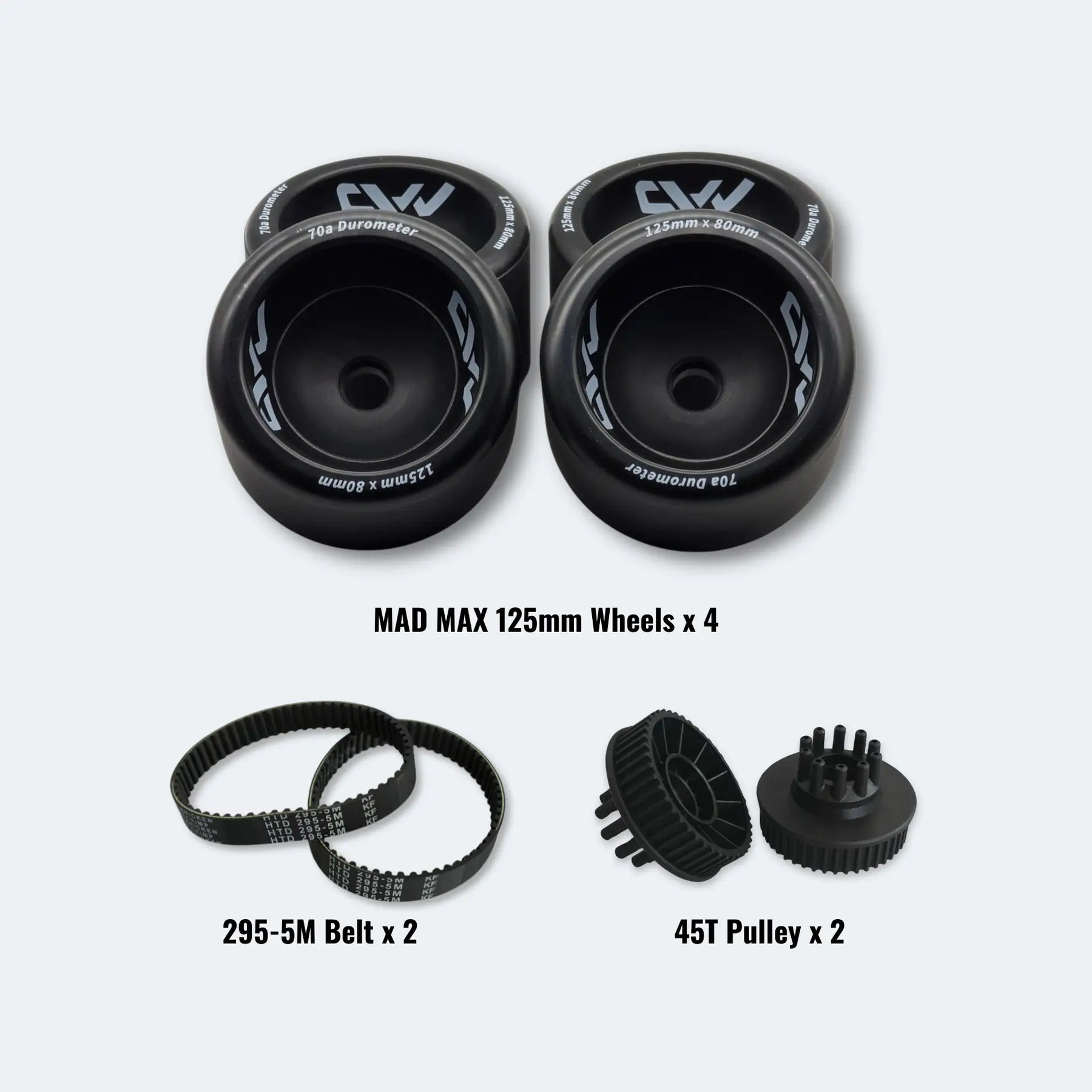 Set of MAD MAX 125mm wheels, 295-5M belt, and 45T pulley on a white background