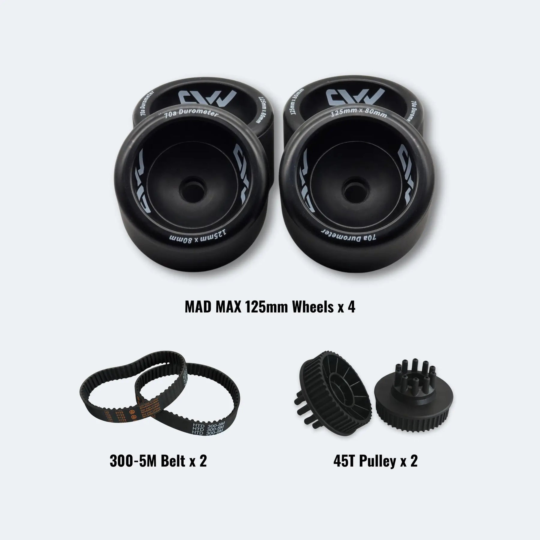 Set of MAD MAX 125mm wheels, 300-5M belt, and 45T pulley on a white background