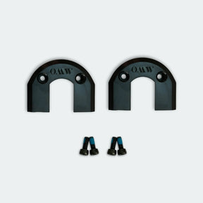 Two black electric skateboard belt covers with screws