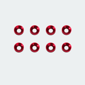 Red metal washers arranged in two rows on a white background
